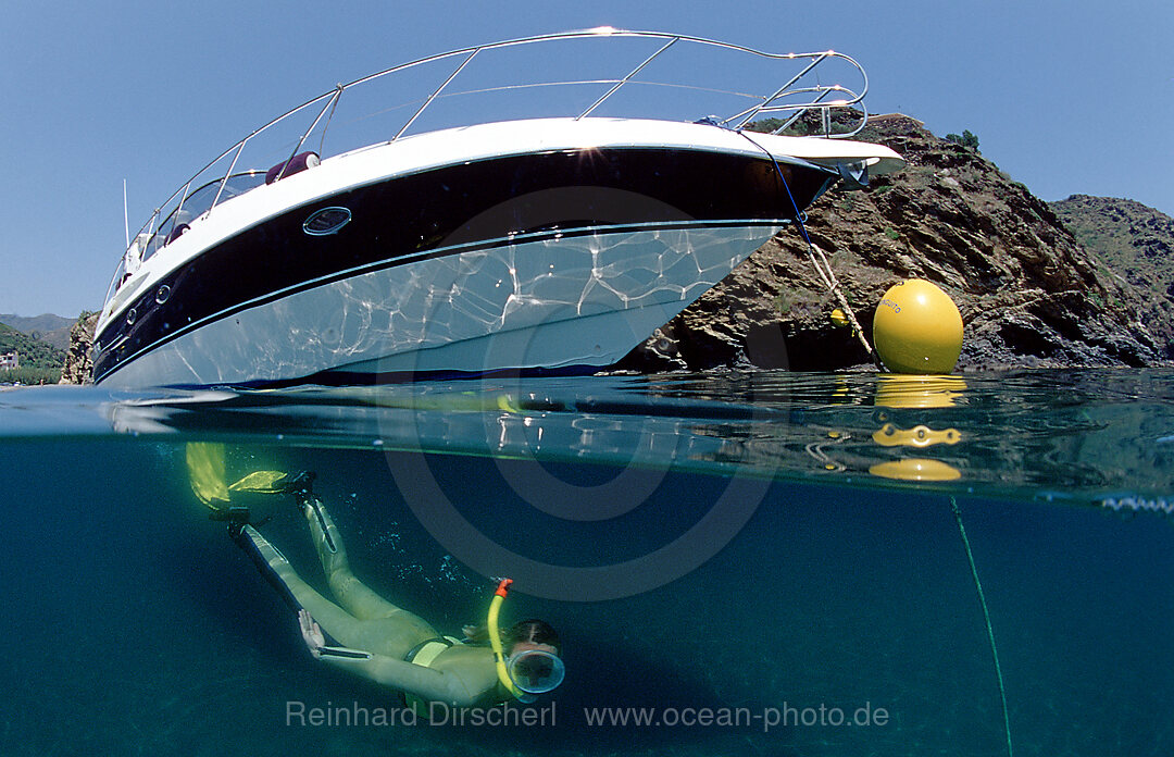 Skin diving in front of a yacht, split image