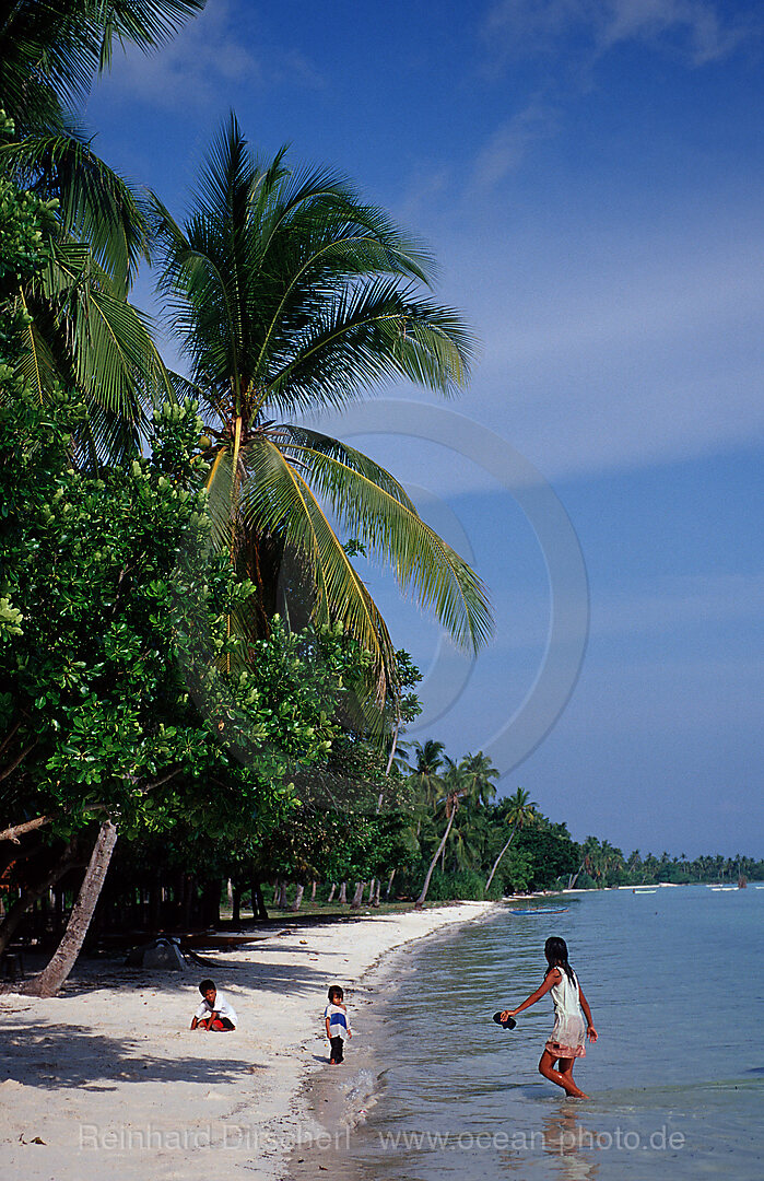 Child plays on the beach, Ananyana Resort, Panglao Island, Bohol, Philippines