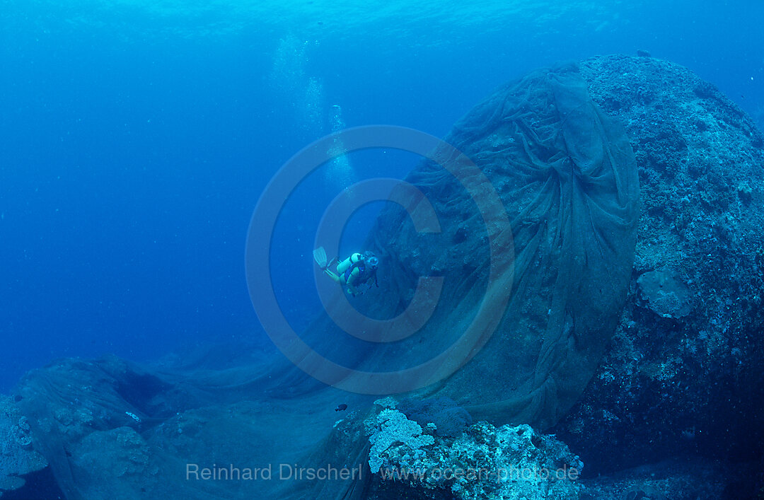 Lost fishnet over coral reef