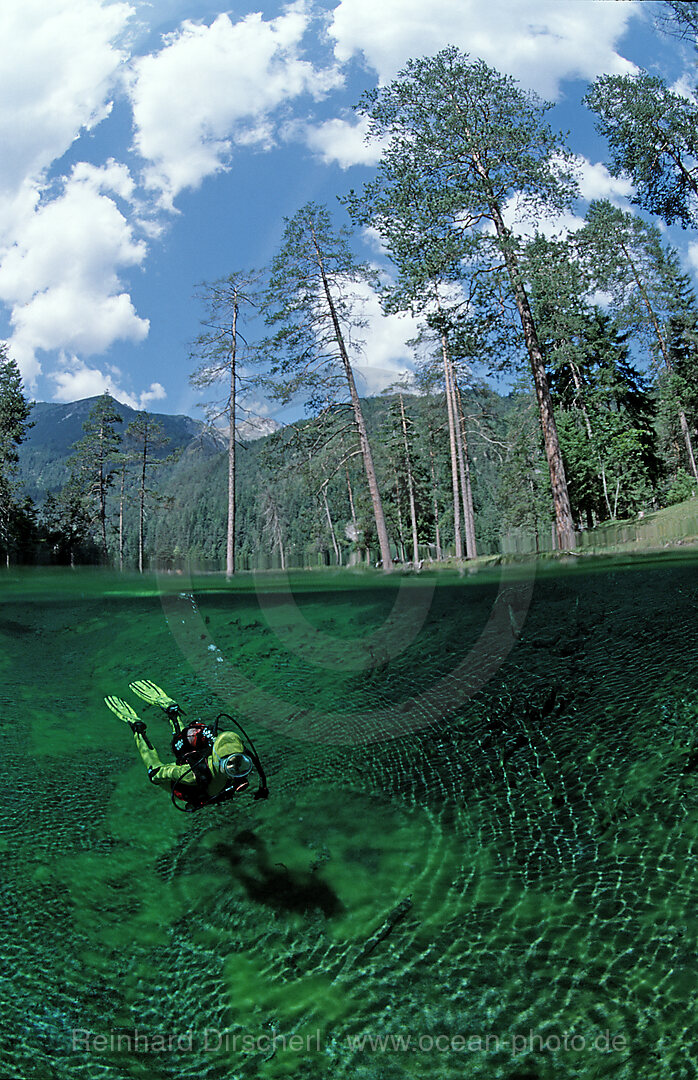 Scuba diver in mountain lake, Tirol, Austria