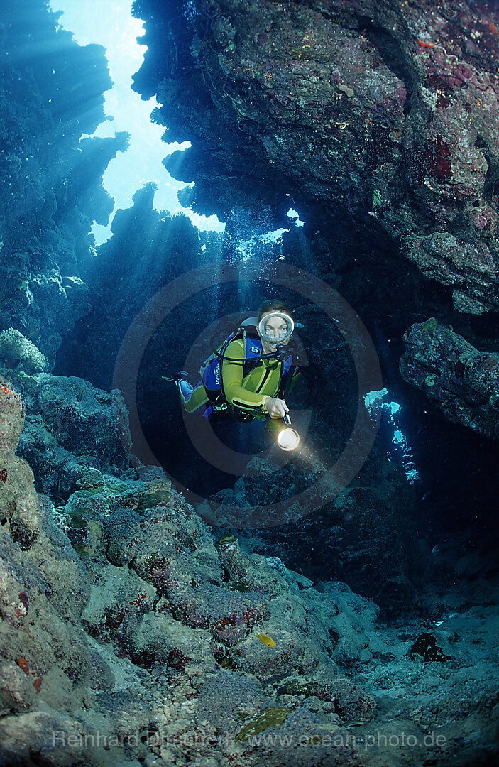 Scuba diver in underwater grotto