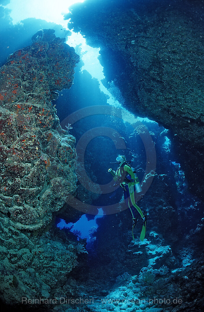 Scuba diver in underwater grotto