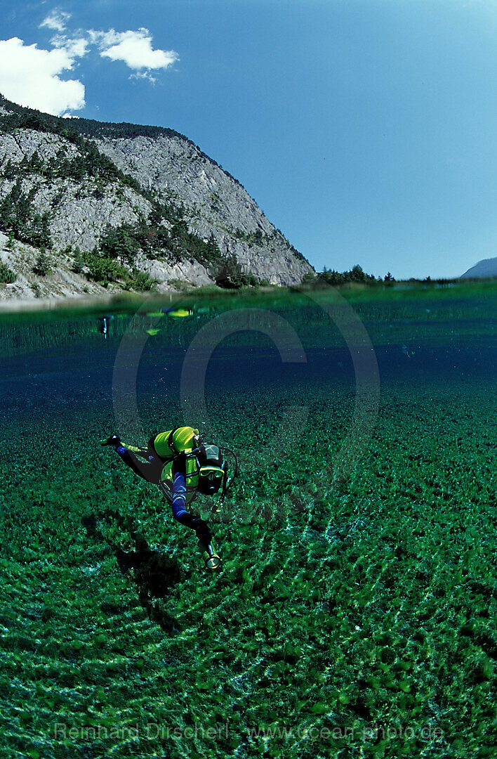 Scuba diver in mountain lake, Tirol, Austria