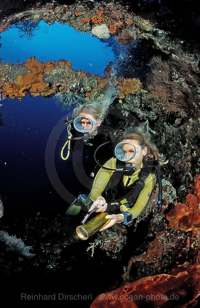 Two Scuba diver examine ship wreck Liberty