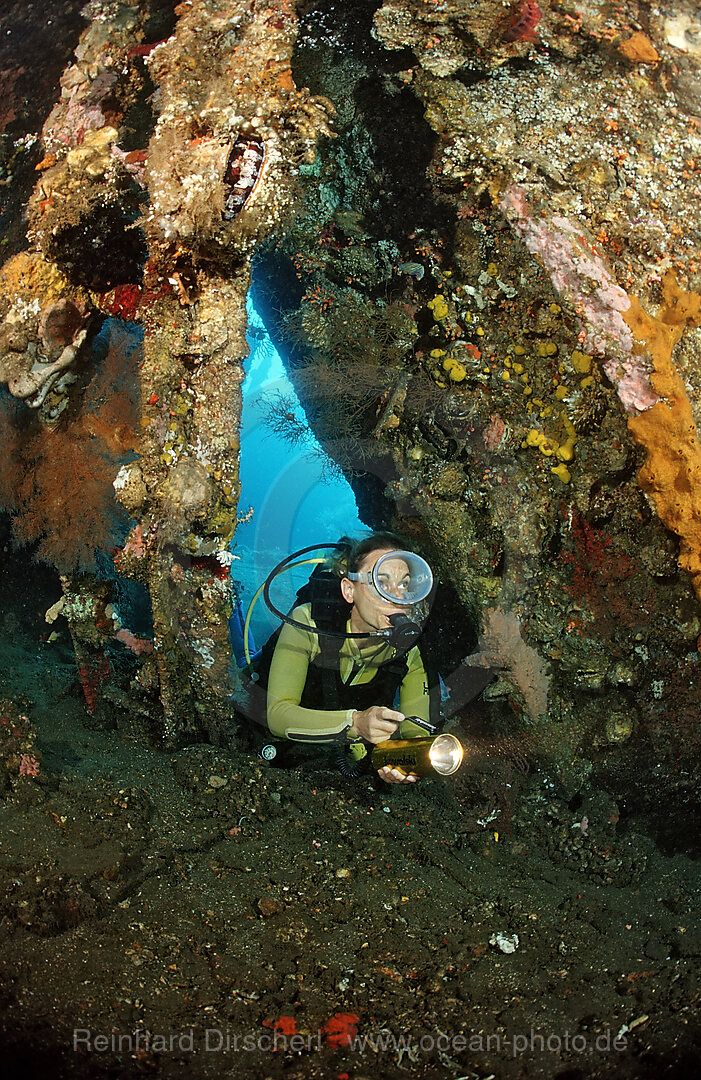 Scuba diver examines ship wreck Liberty