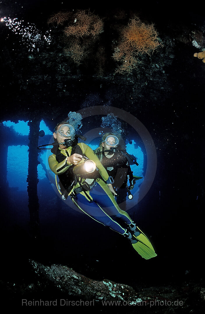 Two Scuba diver examine ship wreck Liberty