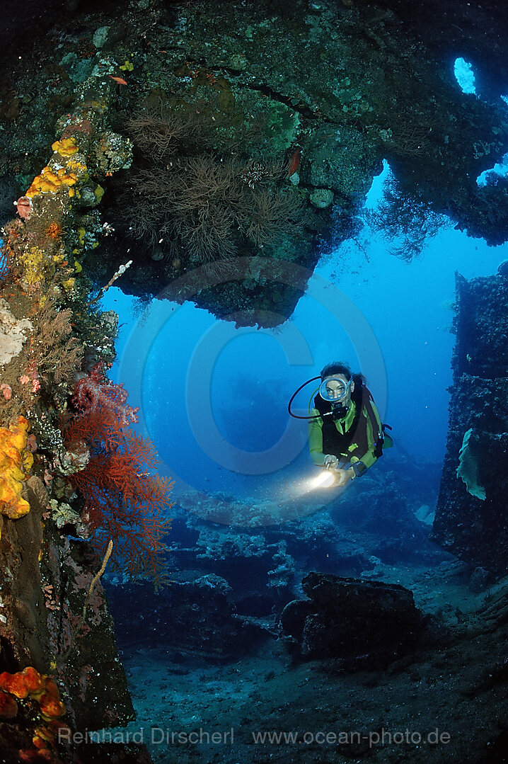 Two Scuba diver examine ship wreck Liberty