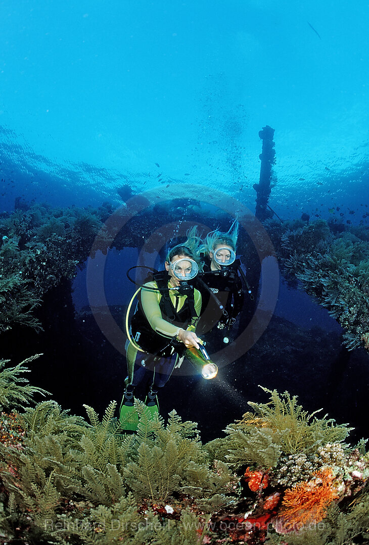 Two Scuba diver examine ship wreck Liberty