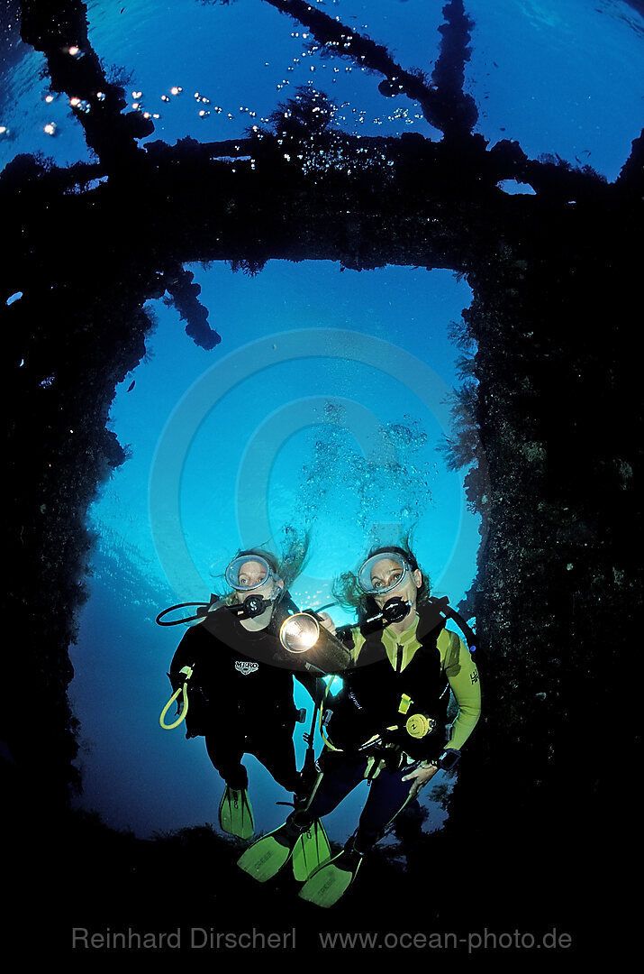 Two Scuba diver examine ship wreck Liberty