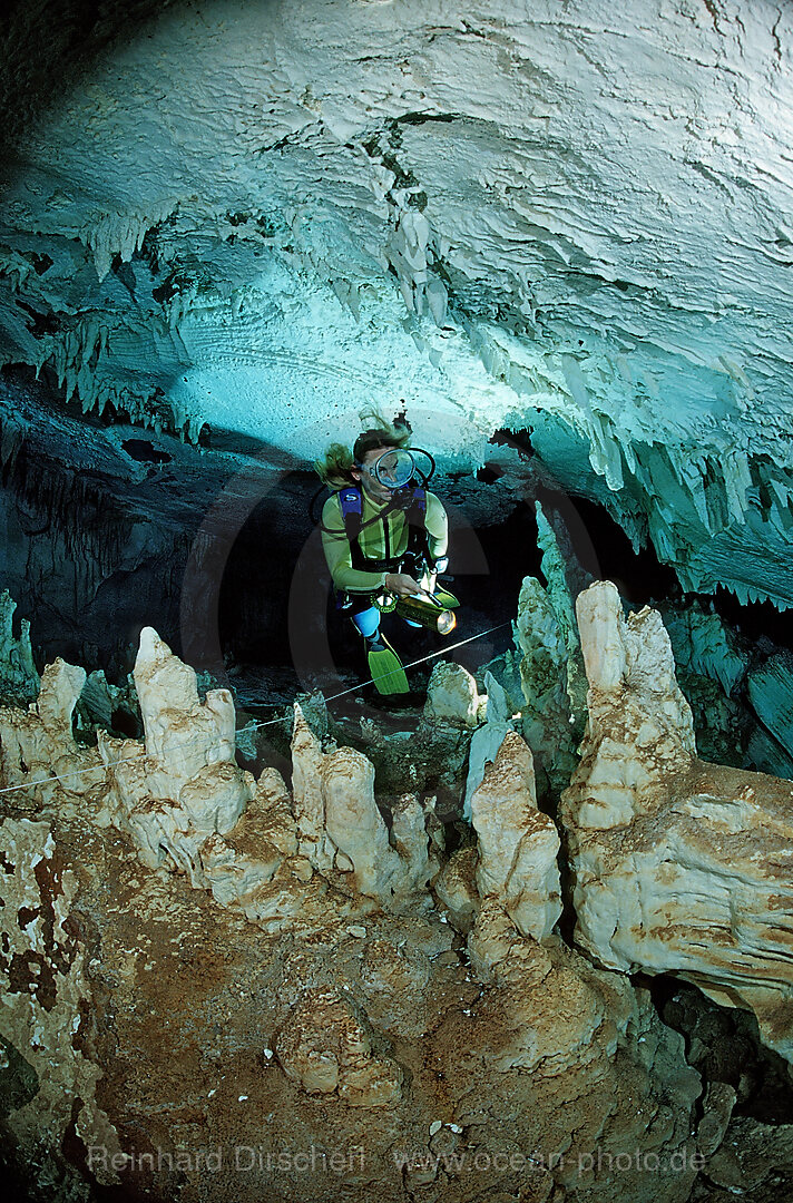 Scuba diver in underwater cave Cueva Taina