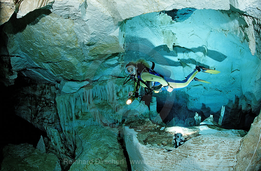 Scuba diver in underwater cave Cueva Taina