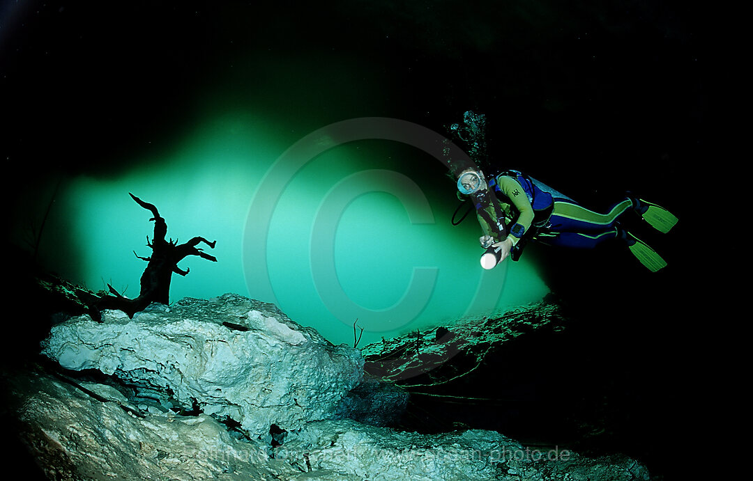Scuba diver in underwater cave Laguna Pepe