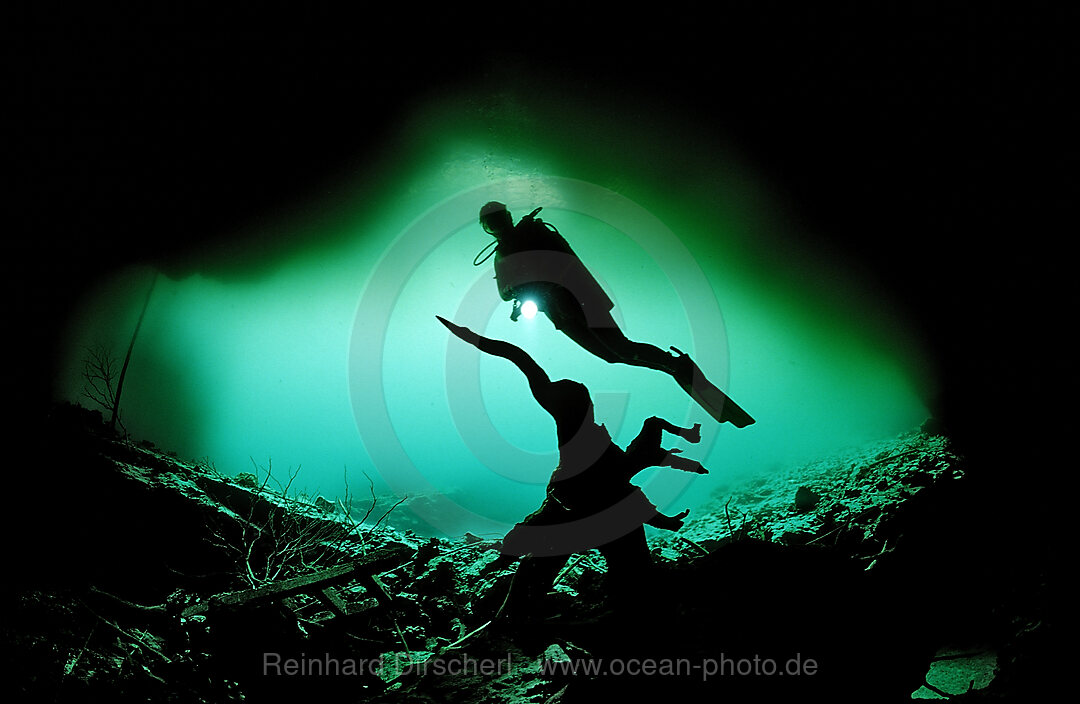 Scuba diver in underwater cave Laguna Pepe