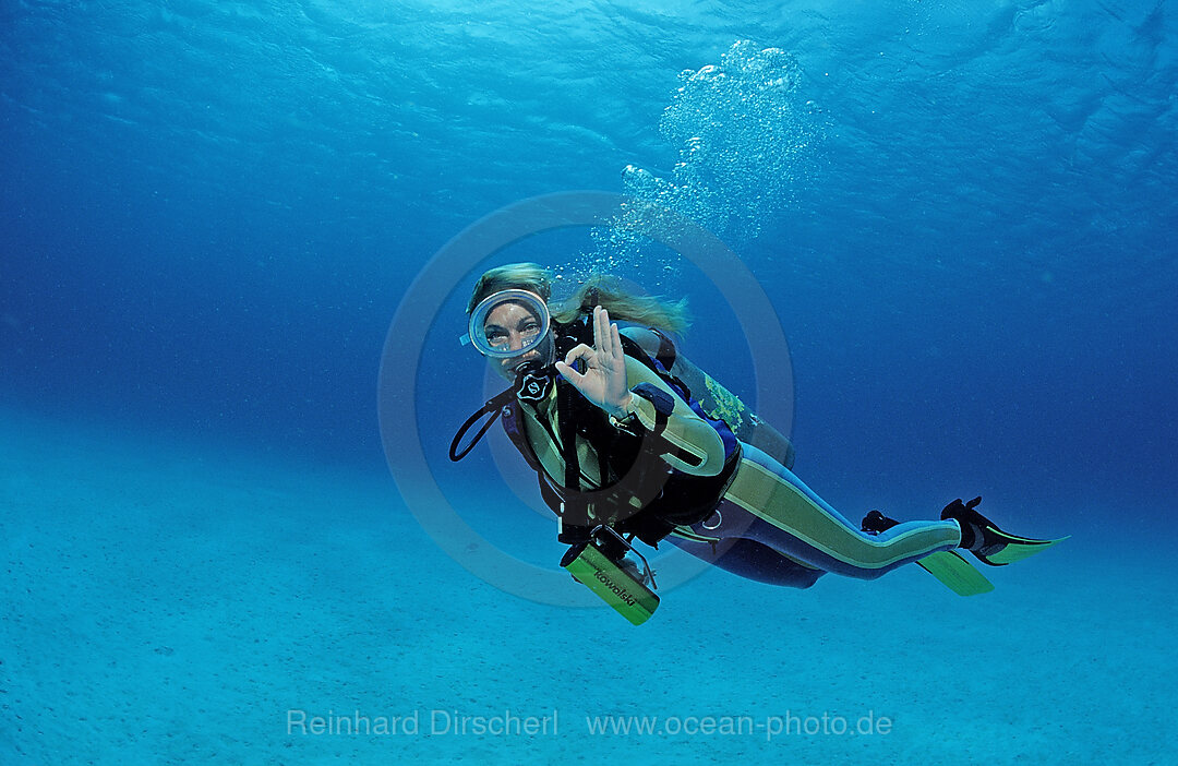 Scuba diver shows o.K. signal, Caribbean Sea, Netherlands Antilles, Bonaire