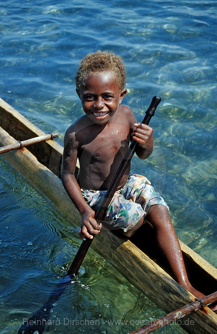 Childs in an Outrigger boat