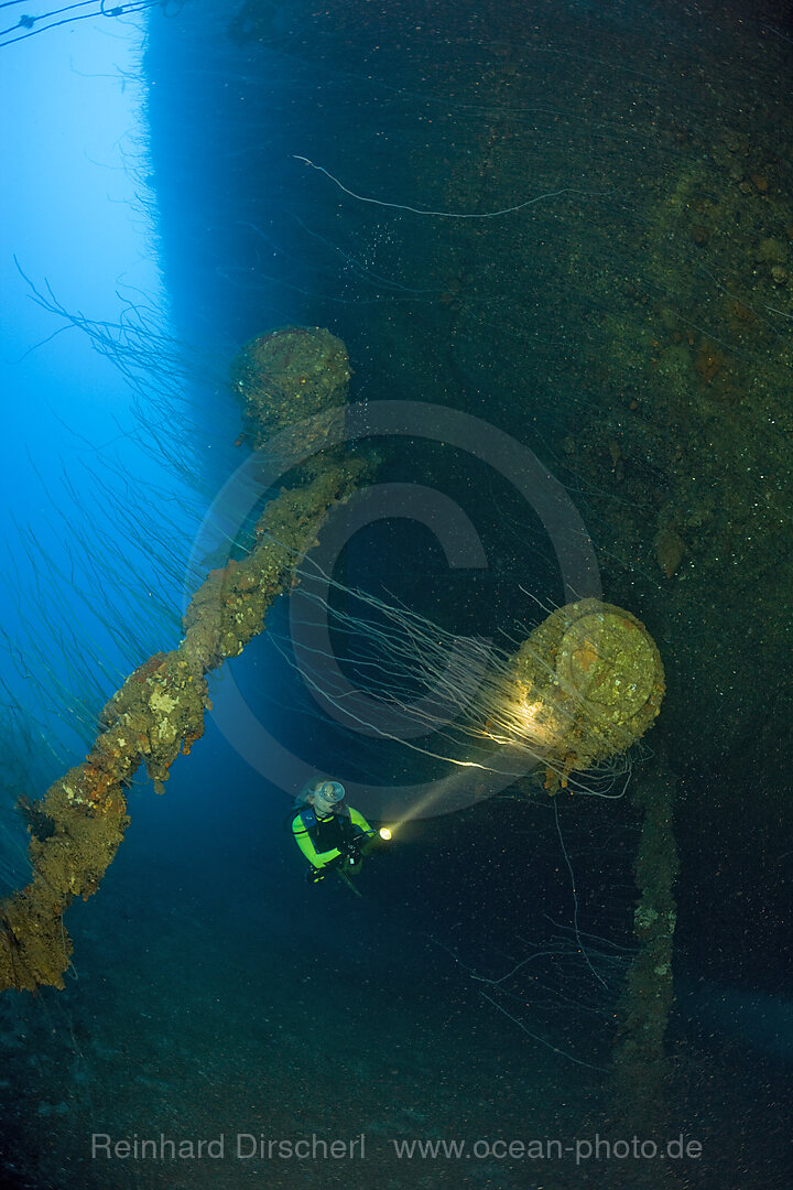 Diver at massive 16-inch 45 Caliber Gun under the HIJMS Nagato Battleship