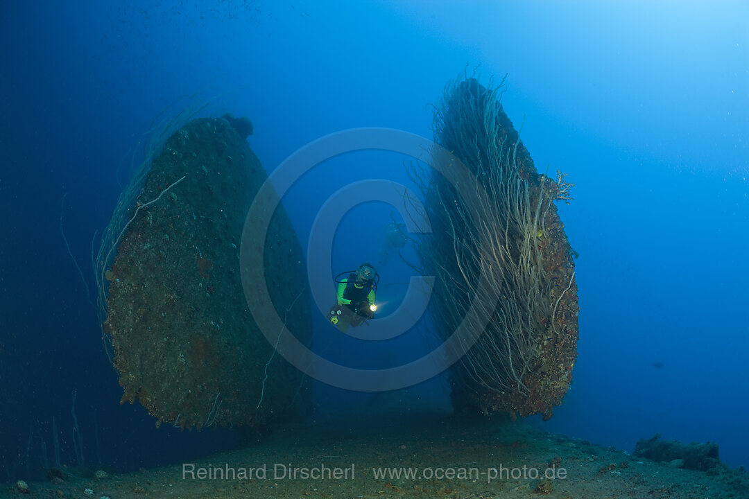 Diver between Rudder of bottom up laying HIJMS Nagato Battleship