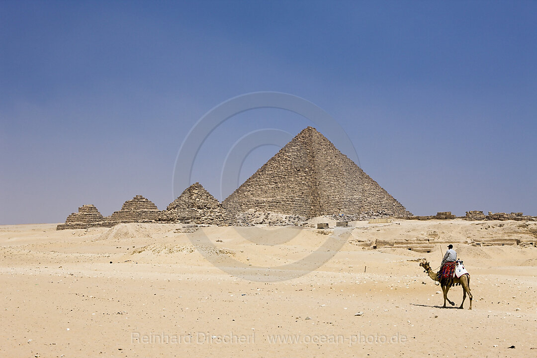 Pyramid of Menkaure and three small Pyramids of Queens