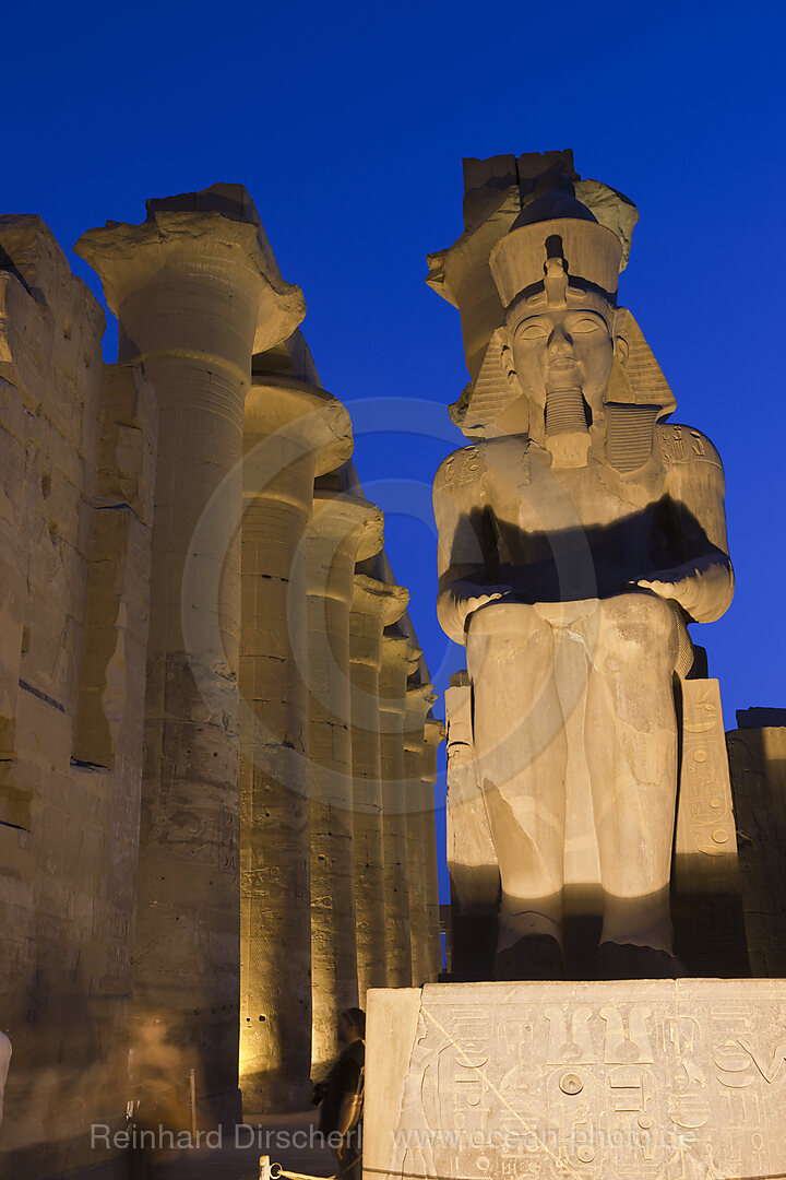 Illuminated Sitting Ramesses II Colossus inside Luxor Temple