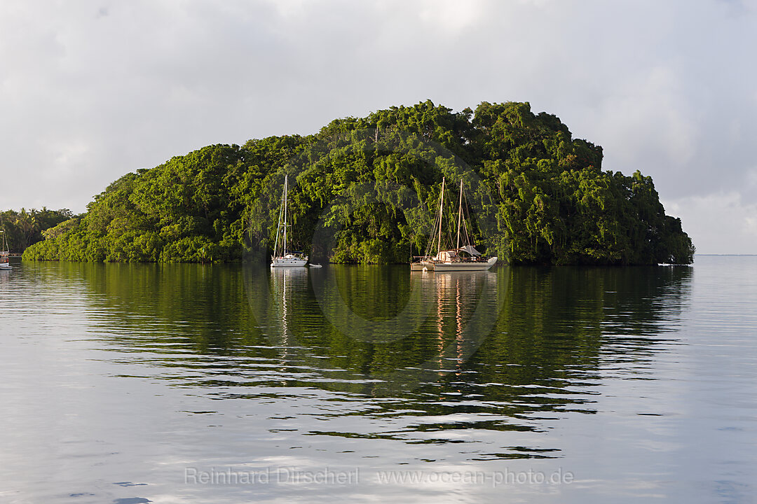 Sailing Boats anchor near Island