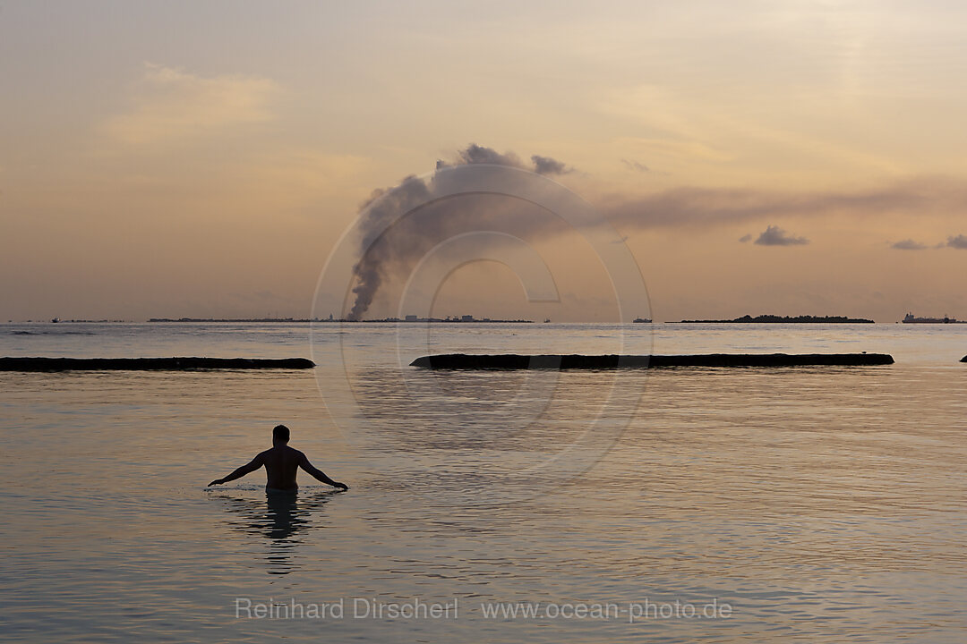 Garbage incineration plant smoking in background, North Male Atoll, Indian Ocean, Maldives