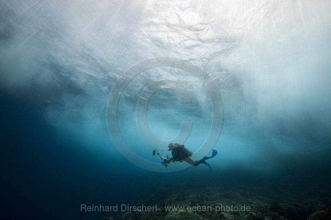 Scuba diver in surf zone, Christmas Island, Australia