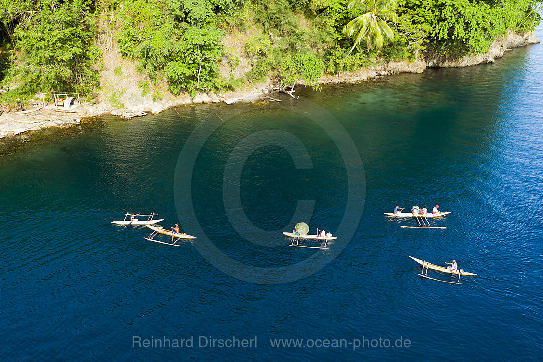 Residents in Outrigger Canoe, Tufi, Cape Nelson, Papua New Guinea