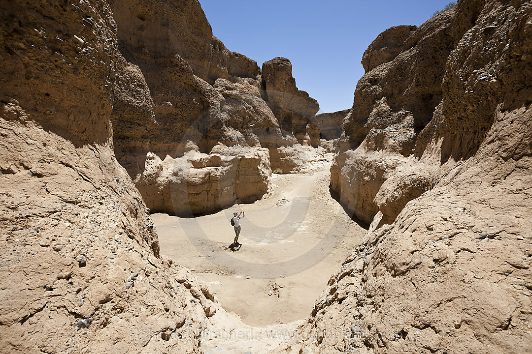 Tourist inside Sesriem Canyon, Namib Naukluft Park, Namibia