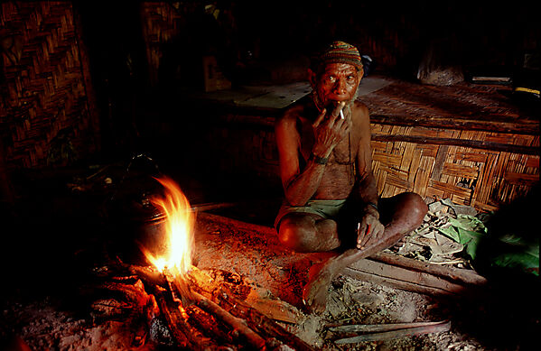 Huli makes fire in his house