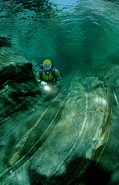 Scuba diving in a freshwater river, scuba diver