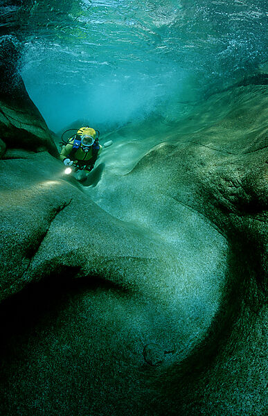 Scuba diving in a freshwater river, scuba diver