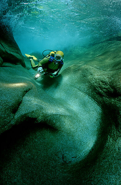 Scuba diving in a freshwater river, scuba diver