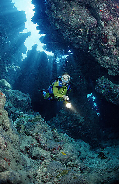 Scuba diver in underwater grotto