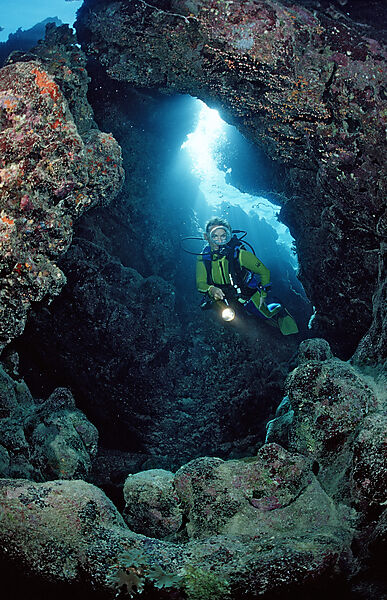 Scuba diver in underwater grotto