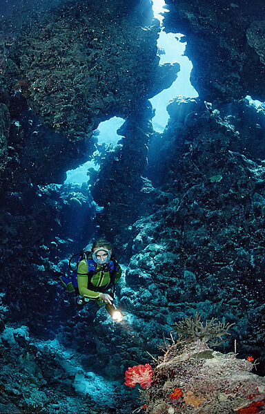 Scuba diver in underwater grotto