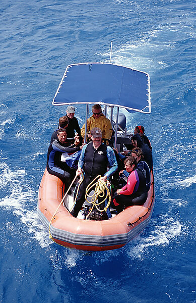 Rubberboat with snorkelers and divers