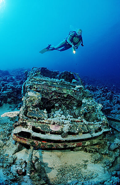 Scuba diver and Car wreck near Blue Belt shipwreck