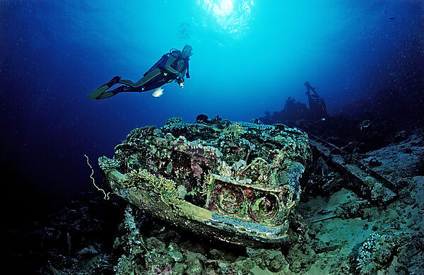 Scuba diver and Car wreck near Blue Belt shipwreck