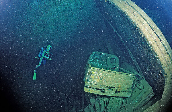 Scuba diver and Truck wreck in Blue Belt shipwreck