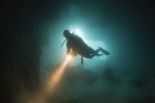Diver at Entrance of Chandelier Dripstone Cave