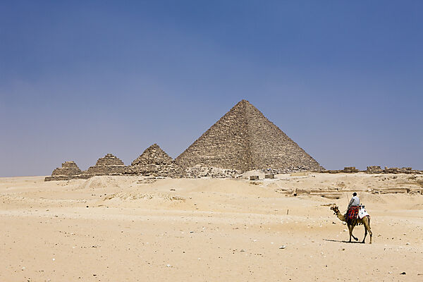 Pyramid of Menkaure and three small Pyramids of Queens