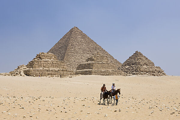 Pyramid of Menkaure and three small Pyramids of Queens