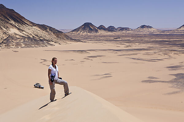 Tourist on 50-Meter Dune in Black Desert