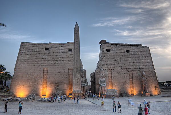 Illuminated Entrance of Luxor Temple with Ramesses II Statue and Obelisk