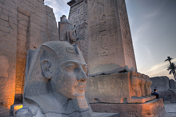 Illuminated Entrance of Luxor Temple with Ramesses II Statue and Obelisk