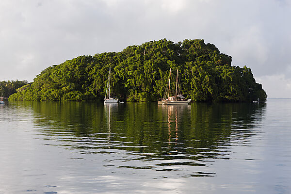 Sailing Boats anchor near Island