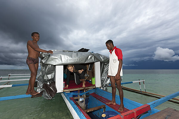 Photographer camp on Outrigger Boat