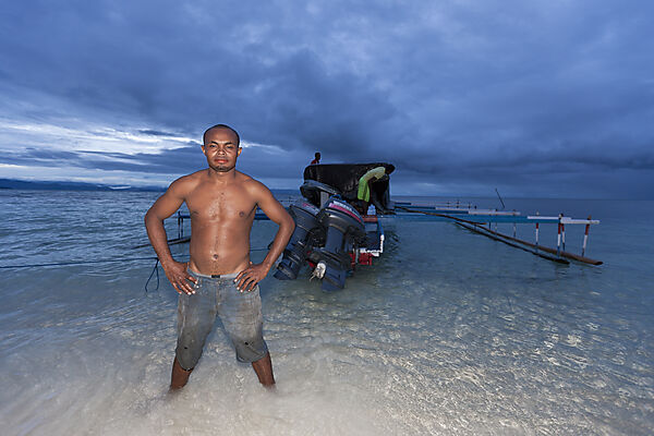 Boatman and his Outrigger Boat