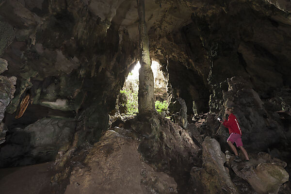 Tourist inside Kotilola Cave