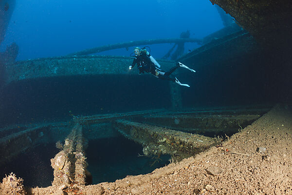 Scuba Diver over Cargo Space of Maldive Victory Wreck
